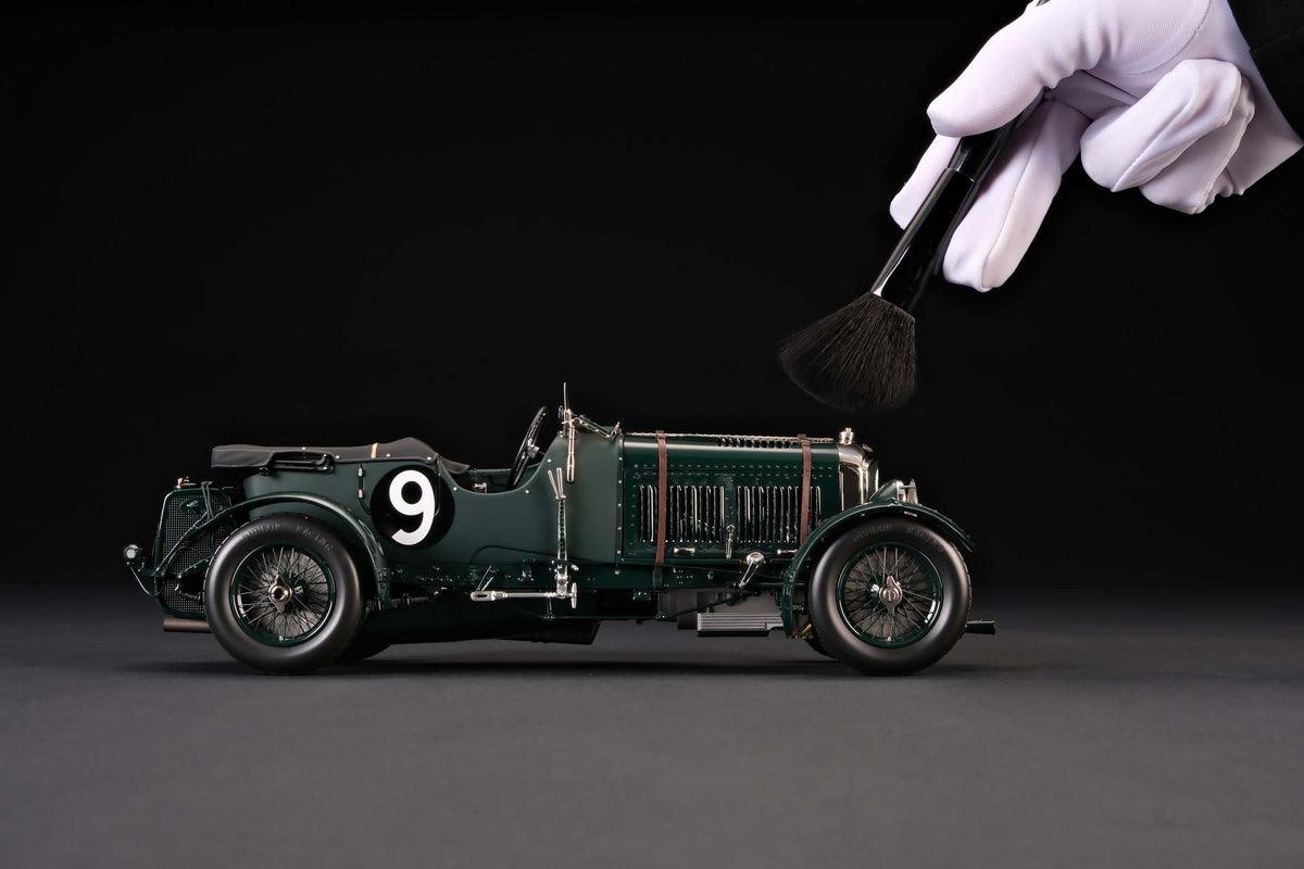 "1929 Bentley Blower" - 1930 Le Mans - Birkin & Chassagne - a dark green vintage 1:18 scale model positioned on a dark background.
