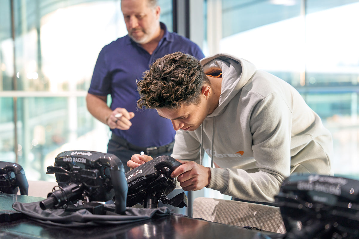 Lando Norris, McLaren Racing. signing Amalgam Collection full size replicas of the McLaren MCL36 steering wheel 