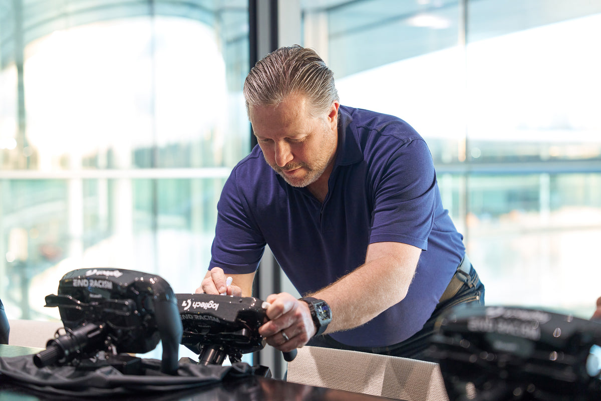 Zak Brown, McLaren Racing. signing Amalgam Collection full size replicas of the McLaren MCL36 steering wheel 