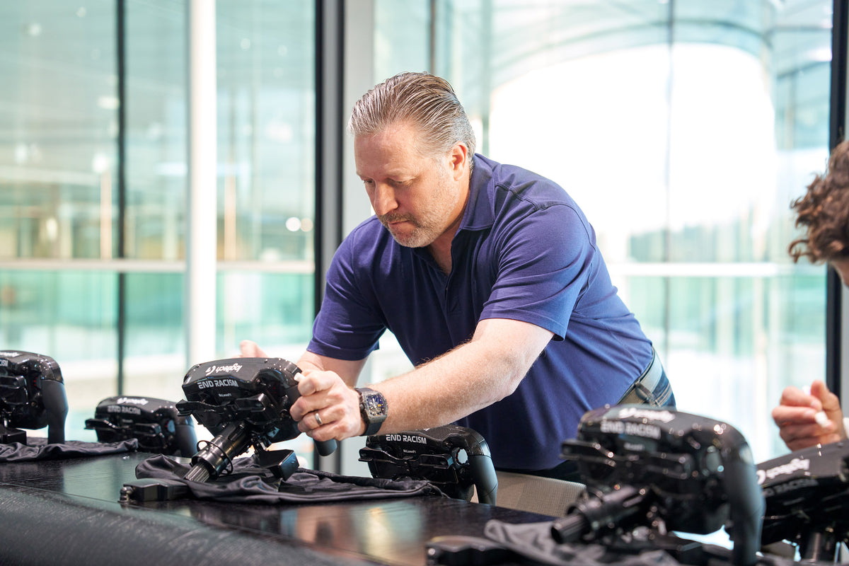 Zak Brown, McLaren Racing. signing Amalgam Collection full size replicas of the McLaren MCL36 steering wheel 
