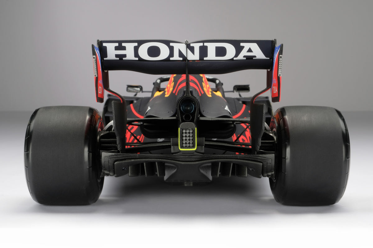 A 1:8 scale model of Sergio Perez's Red Bull Racing Honda RB16B on a neutral background.