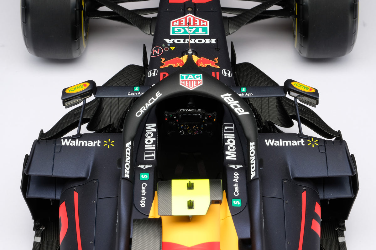 A 1:8 scale model of Sergio Perez's Red Bull Racing Honda RB16B on a neutral background.