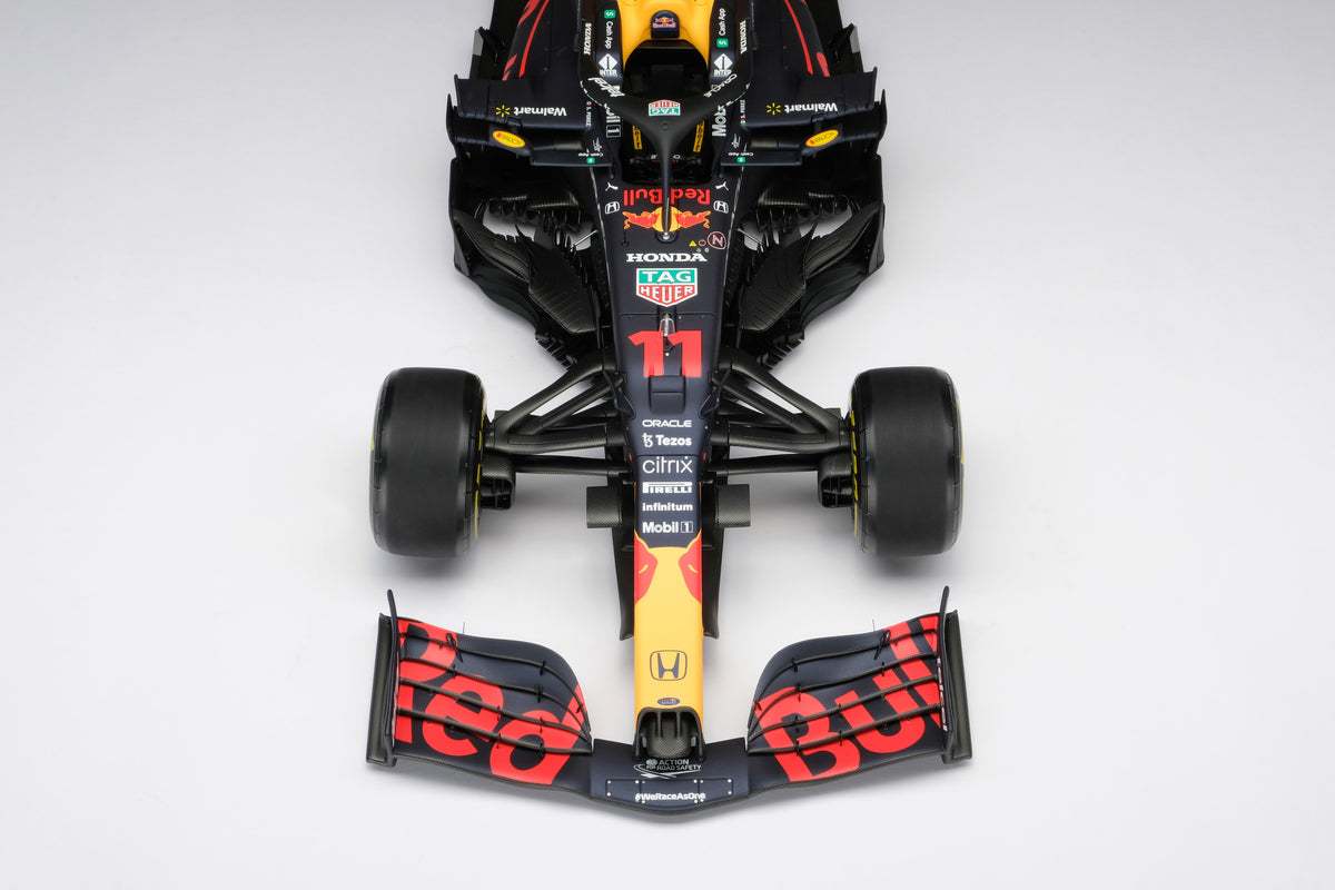 A 1:8 scale model of Sergio Perez's Red Bull Racing Honda RB16B on a neutral background.
