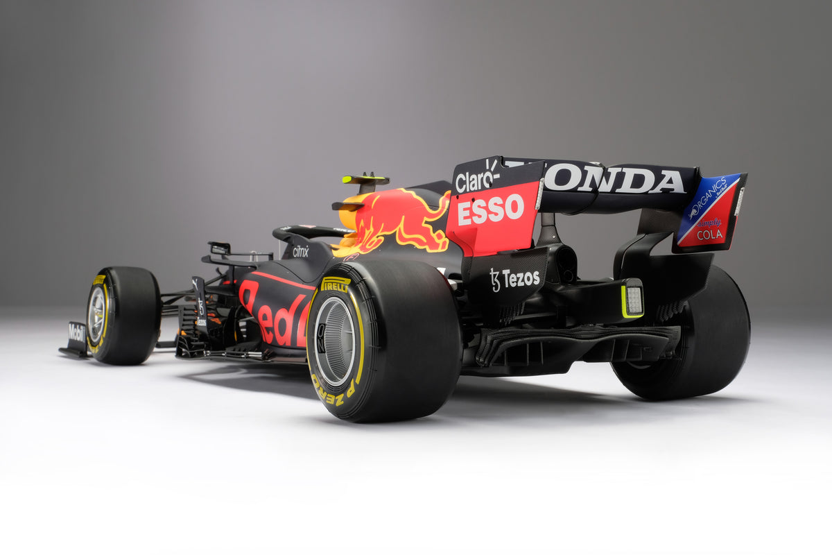 A 1:8 scale model of Sergio Perez's Red Bull Racing Honda RB16B on a neutral background.