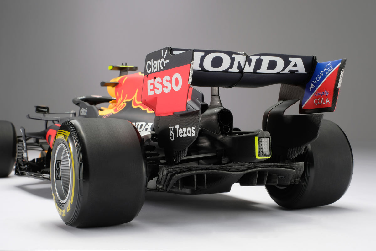 A 1:8 scale model of Sergio Perez's Red Bull Racing Honda RB16B on a neutral background.