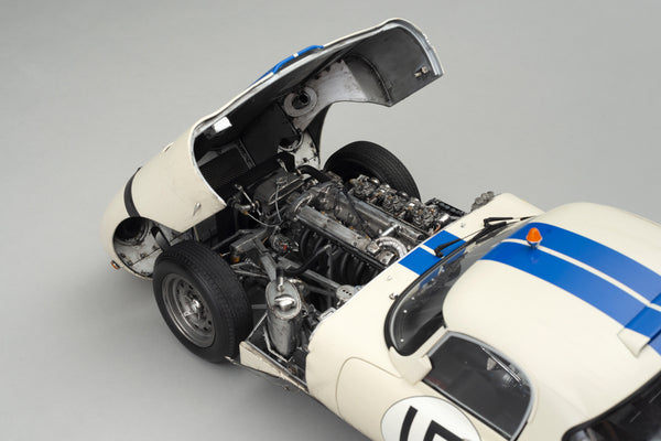 This 1:8 scale race-weathered Jaguar E-type Lightweight (XKE) recreates the #15 car driven by Briggs Cunningham and Bob Grossman at the 1963 24 Hours of Le Mans. Originally a road car, the This 1:8 scale race-weathered Jaguar E-type Lightweight (XKE) recreates the #15 car driven by Briggs Cunningham and Bob Grossman at the 1963 24 Hours of Le Mans. Originally a road car, the